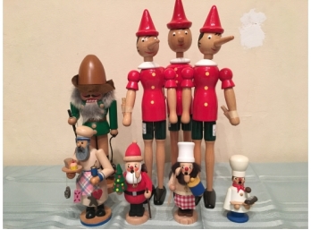 Three Wooden Pinocchios, One Nut Cracker, And Four Smokers