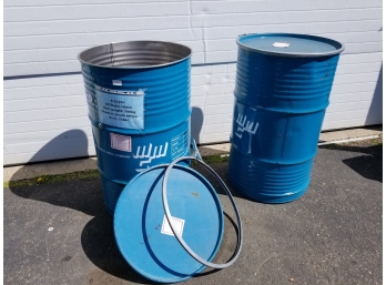 Two 30 Gal Metal Barrels With Lids
