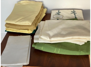 Assortment Of Used Linens And New Sheet