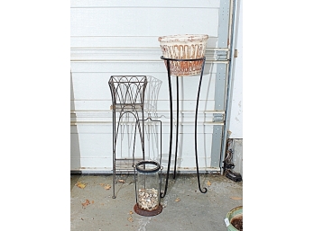 Two Wrought Iron Plant Stands And A Tall Iron And Glass Lantern