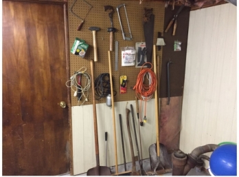 Wall Of Tools And Hardware Pictured.