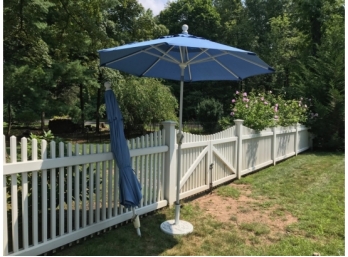 Two Patio Umbrellas And A Stand