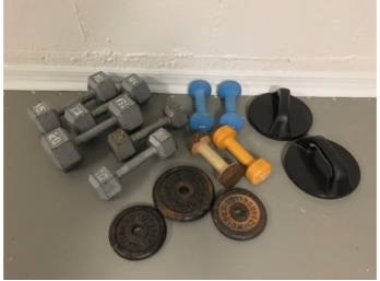 Group Of Hand Weights And Weight Bench Weights.