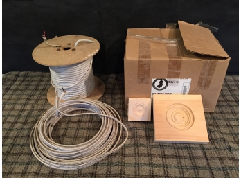 Box Of Pine Molding Rosettes And Electrical Wire Spool