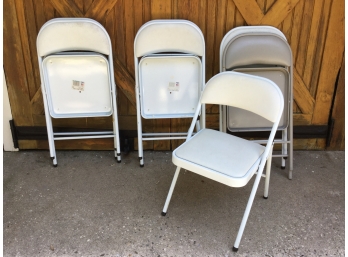 Seven Padded Folding Chairs