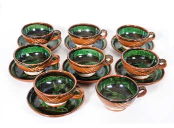 Set Of Seven Glazed Terracotta Animal Motif Teacups And Six Saucers