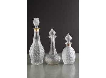 Three Glass Carafes With Stoppers
