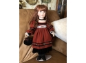 (#160) Porcelain Doll With Stand- Finger Is Broken