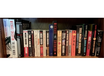 Lot Of Books Featuring Michael Crichton And Clive Cussler