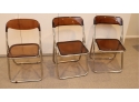 Set Of 3 Amber Acrylic Folding Chair With Chrome Trim  1 Partial Chair