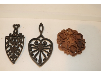 2 Vintage Iron Trivets And 1 Wood One