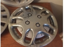 Hubcap Assortment-2 Metal, The One Standing Up Is Plastic
