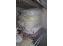 Closet Of Linens & Chrome Toilet Paper Holders