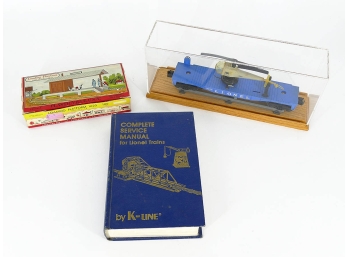 Lionel O-Scale Model Train Flat Car, Lionel Service Manual, And Model Platform