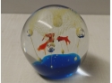 Art Glass Paperweight Depicting Fish Underneath Net