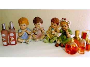 4 Ceramic Babies With And Assorted Colognes / One Has A Chip