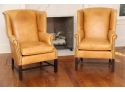 A Pair Of Distressed Mustard Yellow Leather Arm Chairs With Nailhead Trim By Lee Industries