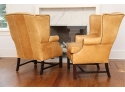 A Pair Of Distressed Mustard Yellow Leather Arm Chairs With Nailhead Trim By Lee Industries