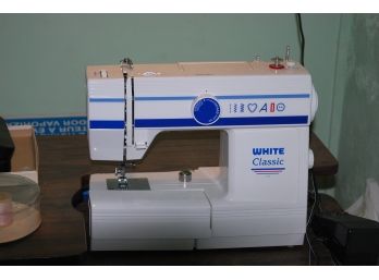 White Sewing Machine And Table