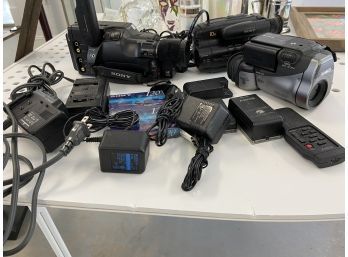 3 Assorted Video Cameras W/ Batteries And Chargers