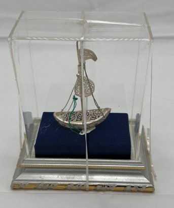 Silver Boat Encased In An Acrylic Case