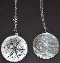 (2) STERLING TOKENS W/ STERLING CHAINS