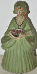 PAINTED CAST IRON WOMAN HOLDING FLOWERS DOORSTOP