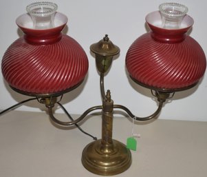 BRASS DOUBLE ELECTRIFIED STUDENT LAMP W/ RED CASED SWIRL SHADES