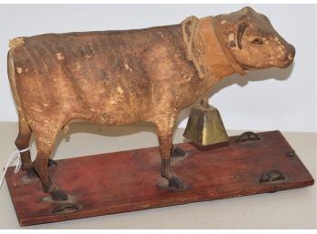 SM. LATE 19TH CENT PAINTED PAPIER MACHE COW PULL TOY