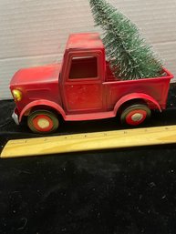 Small Red Metal Truck Hauling A Christmas Tree