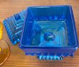 Two  Vintage Candy Dishes. One Ruffle Top Hobnail Amber, The Other Blue Square Lidded.