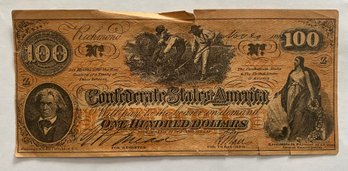 1864 Confederate States $100 Paper Currency Note. The Note Features A Portrait Of J.C. Calhoun