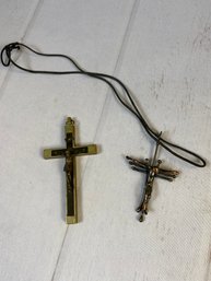 Two Metal Crucifix Pendants, One With A Cord, Necklace