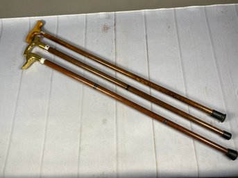 Three Antique Or Vintage Canes, Two With Brass Handles, One With A Wooden Handle