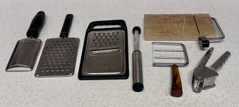Garlic Press And Collection Of Cheese Graters And Slicers