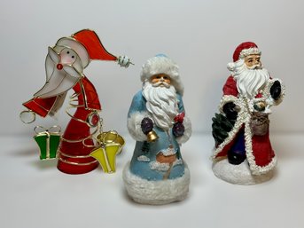 Collection Of Father Christmas Figurines And Tea Light Candle Holder