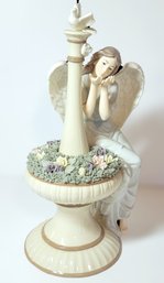 Vintage Porcelain Angel Sitting Upon A Rose Garden