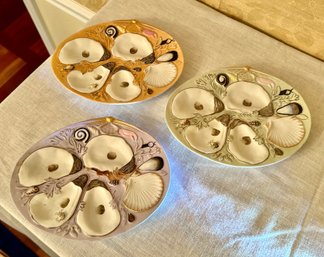 Three Porcelain Oyster Dishes -- Salmon, Lavendar And Celedon Colored