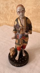 Porcelain Figurine Of Asian Man With Rabbits