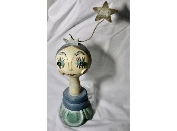 Whimsical Figurine With Accompanying Star