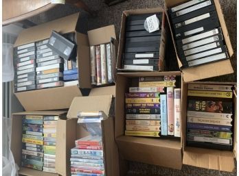 9 Boxes Of Mostly VHS Movies With VHS/DVD Player