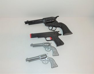 4 Plastic Toy Guns In Various Condition