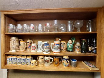 3 Shelves Of Beer Steins And Glasses