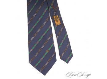 MOST COVETED VINTAGE GUCCI MADE IN ITALY MENS SILK TIE IN NAVY WITH GREEN AND GOLD HORSEBIT STRIPES