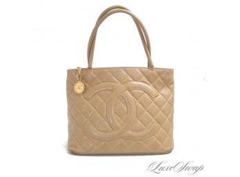 INCREDIBLE AND AUTHENTIC CHANEL BEIGE CAVIAR LEATHER GIANT CC GOLD COIN ZIP TOP PERMANENT COLLECTION HANDBAG