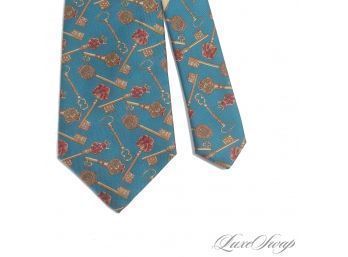 AUTHENTIC AND NEAR MINT SALVATORE FERRAGAMO MADE IN ITALY MENS SILK TIE IN TEAL WITH BAROQUE KEYS PRINT