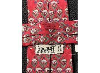NEAR MINT AND AUTHENTIC HERMES PARIS RED TIE WITH PRINTED FLOWERS AND BIRDS 7184 UA