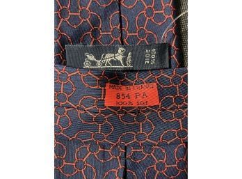 NEAR MINT AND AUTHENTIC HERMES PARIS MADE IN FRANCE NAVY SILK TIE WITH RED HORSEBIT 854 PA