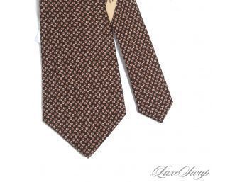 AUTHENTIC AND NEAR MINT SALVATORE FERRAGAMO MADE IN ITALY MENS SILK TIE IN BLACK WITH BROWN NUT PRINT