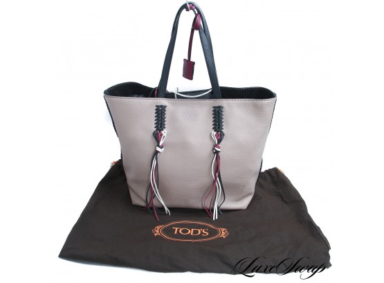 A RECENT, LIKE NEW, AND VERY EXPENSIVE TODS MADE IN ITALY TAN TOTE BAG WITH TRICOLOR TASSELS